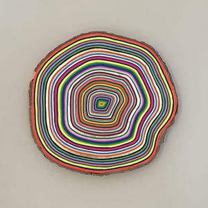 Colorful painting on wood slice