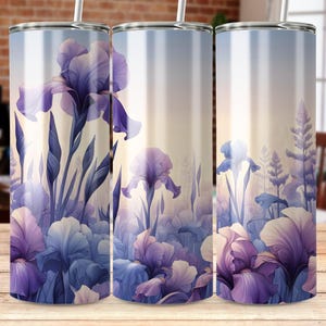 May include: Three stainless steel tumblers with a floral design featuring purple and white irises. The background is a gradient of light blue to white.