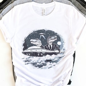 Stylish Dinosaur Shirt, Business Dinos in UFO T-Shirt, Sleek UFO Meme Design, Sci-Fi Shirt, UFO Dinosaurs, Funny Alien Dino Meme
