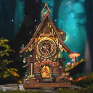 May include: A wooden clock model with a whimsical design. The clock features a detailed face with heart-shaped accents and the text "Fall down the rabbit hole." The clock is brown, red, and yellow, with a Wonderland theme.
