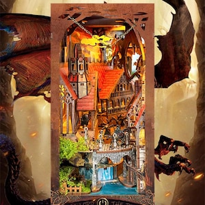 Peut inclure: Maquette en bois détaillée d'une cité fantastique avec des toits rouges, des ponts et une cascade. Le modèle est éclairé de l'intérieur, créant une lueur chaleureuse. Le texte "LORD OF THE RINGS" est visible en bas.