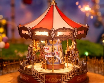 May include: A wooden carousel with a red and white striped roof, gold accents, and four horses. The carousel is lit up with small lights and has a whimsical, vintage aesthetic.