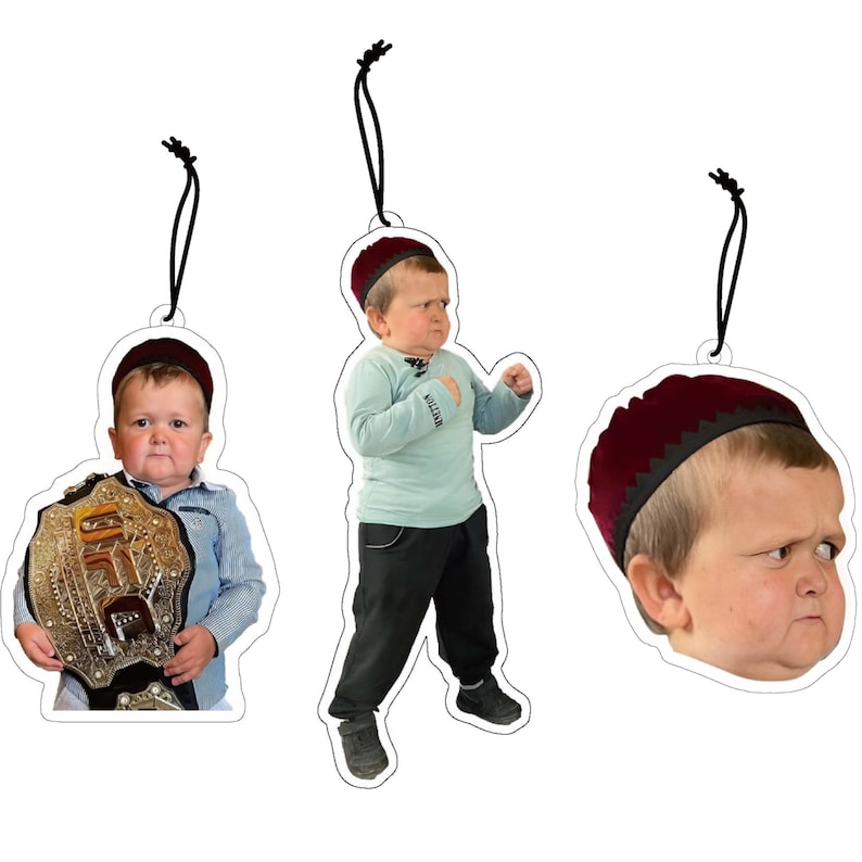May include: Three different Christmas ornaments featuring a young boy wearing a red hat. One ornament shows the boy holding a championship belt, another shows the boy in a fighting stance, and the third shows a close-up of the boy's face.