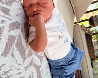 Nancy Lee.  Payment 2. Paid in Full. Caspian  Authentic Biracial Full Limb Silicone Partial Baby Boy (Cloth Body). Comes with COA.
