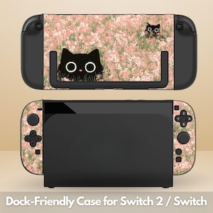 May include: A black Switch 2 / Switch dock-friendly case with a pink floral design and black cat illustrations. The case features a black base and a matching design on the controllers. The text "Dock-Friendly Case for Switch 2 / Switch" is at the bottom.