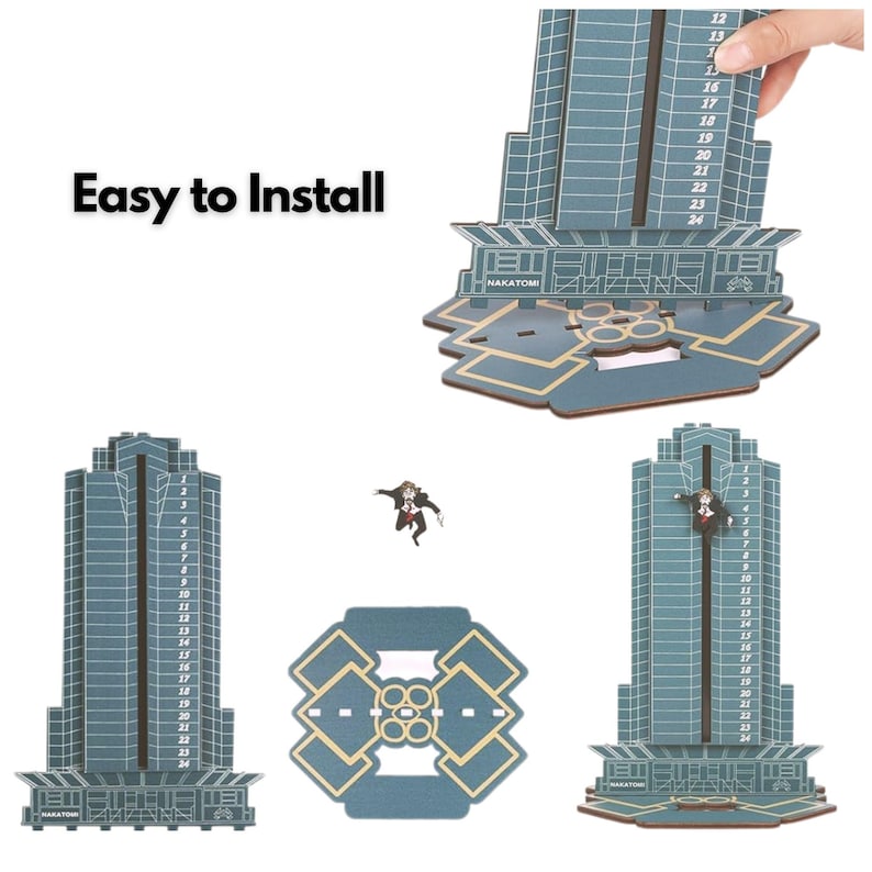 May include: A blue and tan wooden Nakatomi Plaza building model with the text "Easy to Install". The model has a detailed facade, a base, and a figure of a person. The building has numbers from 12 to 24.