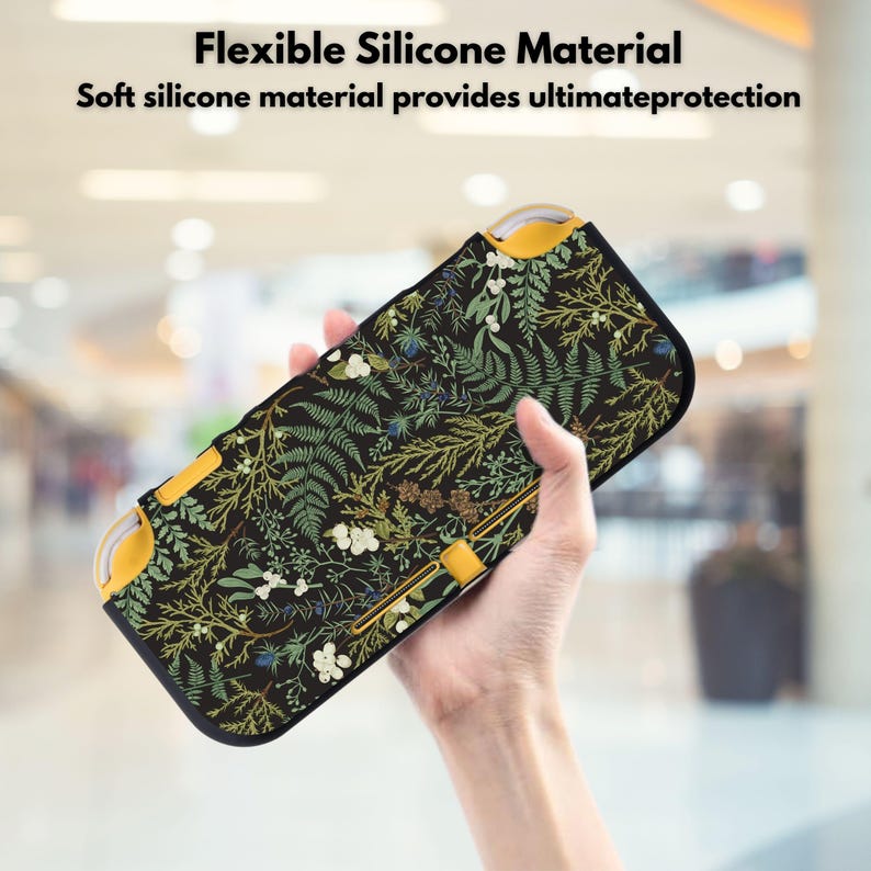 May include: Black and yellow protective case with a botanical pattern. The case features a dark background with green, white, and brown plant illustrations. The text "Flexible Silicone Material" and "Soft silicone material provides ultimate protection" is visible.