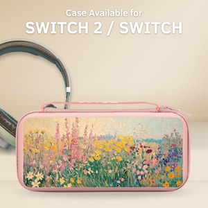 Puede incluir: Una funda rosa para Switch 2 / Switch con un diseño de pintura floral. La funda tiene cierre de cremallera y asa. También se ve un par de auriculares.