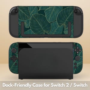 May include: A dock-friendly case for Switch 2 / Switch. The case has a dark green leaf pattern with gold detailing. The image shows the top and bottom of the case, with the Switch console in the middle.