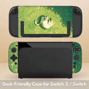 May include: A black and green Nintendo Switch case with a cat design. The case features a white cat lying on its back in a grassy field. The text "Dock-Friendly Case for Switch 2 / Switch" is at the bottom.