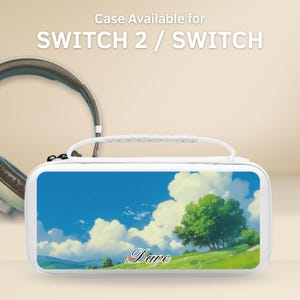May include: White Switch 2 / Switch case with a landscape design of a blue sky, clouds, and green trees. The case has a white handle and the name "Dave" is written on the front. Headphones are visible in the background.