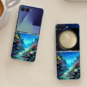 May include: Two phone cases with an underwater design featuring coral, fish, and the word "Dare". The top half of the cases have a dark blue gradient, and the other case has a planet design.