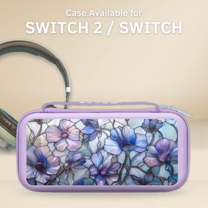 May include: A lilac Switch 2 / Switch case with a floral design. The case has a stained-glass style pattern of blue and purple flowers. The text "Case Available for SWITCH 2 / SWITCH" is at the top. Headphones are visible in the background.