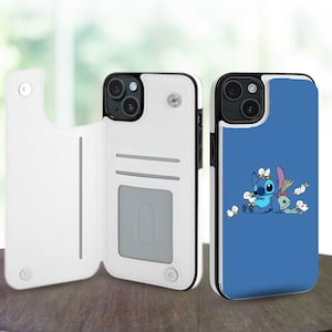 Könnte beinhalten: Weiße und blaue Handyhüllen. Eine Hülle ist offen und zeigt Kartenfächer. Die andere Hülle ist geschlossen und hat einen blauen Hintergrund mit einem Cartoon-Charakter-Design. Beide Hüllen haben einen schwarzen Rand.
