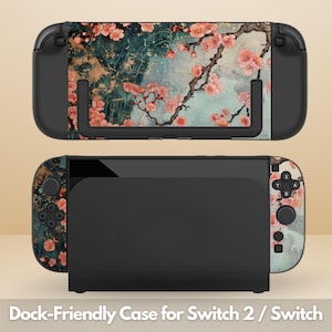 Op de afbeelding: Een zwarte dock-vriendelijke case voor Switch 2 / Switch met een bloemenontwerp. De case heeft een kleurrijk patroon van roze kersenbloesems op een turquoise en gouden achtergrond. De Switch-console is zichtbaar.