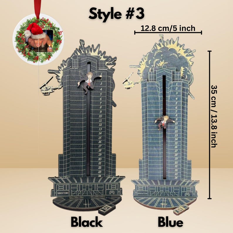 May include: Black and blue wooden Nakatomi Plaza-themed wall decor, 13.8 inches tall and 5 inches wide. Features a falling figure and explosion detail. Includes a small remote control. A Christmas ornament with a photo is also included.