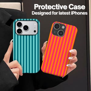 May include: Two protective cases for iPhones. One case features vertical teal and dark blue stripes with a cutout for a triple-lens camera. The other case displays vertical orange and pink stripes with a cutout for a dual-lens camera. Text reads: Protective Case Designed for latest iPhones.
