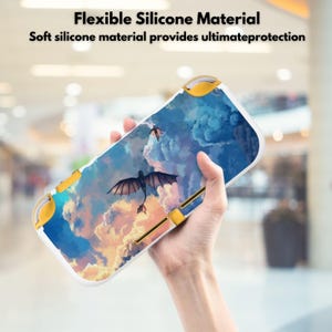May include: A white and yellow protective case for a handheld gaming device. The case features a colorful design of a dragon flying in a cloudy sky. The text "Flexible Silicone Material" and "Soft silicone material provides ultimate protection" is displayed at the top.