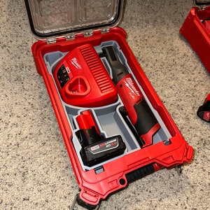May include: A red Milwaukee tool carrying case with a Milwaukee M12 RedLithium XC4.0 battery, a Milwaukee M12 Fuel 1/4" Ratchet, and a Milwaukee M12 battery charger.