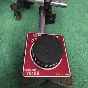 Mitutoyo 7010S is a versatile magnetic stand designed to hold dial indicators and test indicators, comes with factory box.