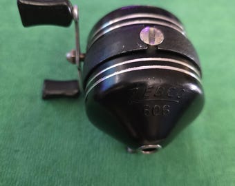 Zebco 1970's model 606 bait casting fishing reel adjustable drag and anti-reverse. The reel is a collectible made in USA.