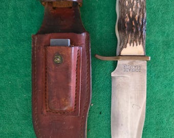 Schrade Uncle Henry collectors 1970's No.171UH hunting knife 5-1/2", bone style handle, sharpening stone & sheath. The knife's #27703.