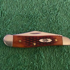 May include: A set of three ceramic mugs with a speckled, matte finish. The mugs are in shades of cream, light gray, and dark gray. Each mug has a simple, minimalist design, perfect for coffee or tea.