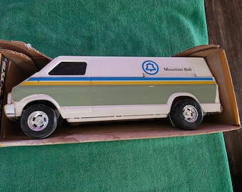 Ertl "Mountain Bell" delivery #3798 die-cast metal toy. The Ertl toy van is new unused in factory box. Great collectible USA.