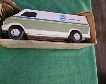 Ertl "Mountain Bell" delivery #3798 die-cast metal toy. The Ertl toy van is new unused in factory box. Great collectible USA.