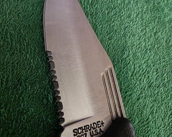 Schrade SG7 lockblade  Knife with heavy rubber handle. Made in the USA.