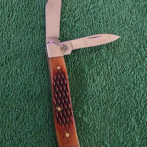 May include: A rustic wooden sign with the text "Welcome to our home" in white lettering. The sign features a distressed finish and a simple, inviting design, perfect for front door decor.