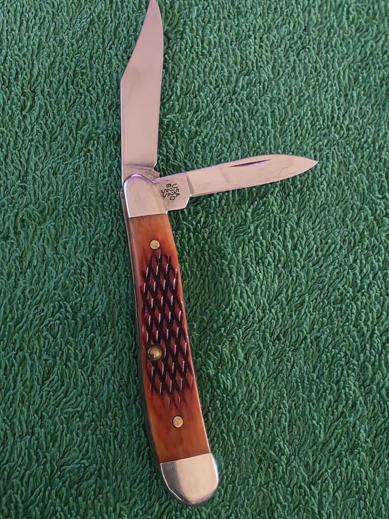 May include: A rustic wooden sign with the text "Welcome to our home" in white lettering. The sign features a distressed finish and a simple, inviting design, perfect for front door decor.