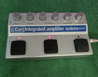 Cort Integrated Amplifier System Stereo mix distortion foot pedal, battery operated & (No A/C power cord ).