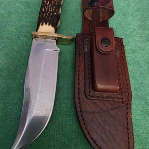 Schrade collectors 1970's No.171UH hunting knife 5-1/2", bone style handle, sharpening sanding stone & leather sheath. The knife's #35597. immagine 1