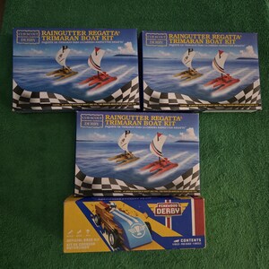Boy and Cub Scouts derby kits. The derby kits are new and unused with 1-pine derby car & 3-Regatta boat kits. Great collectible.