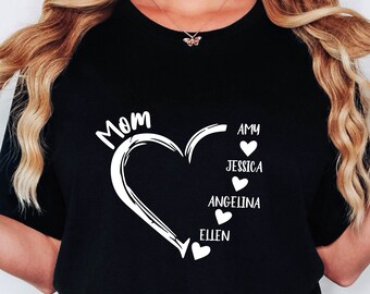 May include: Black t-shirt with a white heart design and the word "Mom" above it. Inside the heart are the names Amy, Jessica, Angelina, and Ellen.