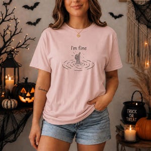 I'm Fine T-Shirt, Humorous Graphic Tee for Men, Fun Gift for Friends, Positive Vibes Sweatshirt, Uplifting Apparel
humorous graphic tee, i'm fine t-shirt, positive vibes sweat, fun gift for friends, uplifting apparel, motivational quote, casual wear men, funny slogan, self-care quote tee, thumbs up design, men's casual t-shirt, graphic design, trendy motivation