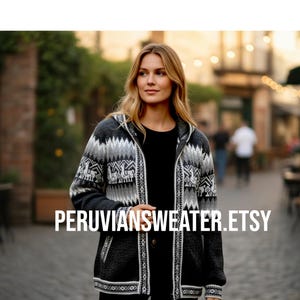 May include: A hooded zip-up sweater with a geometric pattern in shades of gray, black, and white. The sweater has a front zipper and pockets. The text "PERUVIANSWEATER.ETSY" is displayed across the front.
