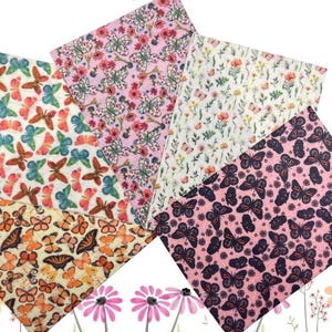May include: Four fabric swatches featuring butterfly patterns. The swatches are pink, white, and light blue with a variety of butterfly designs.