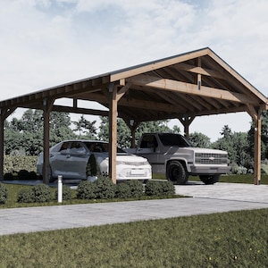 Könnte beinhalten: Ein Carport aus Holz mit Satteldach schützt eine silberne Limousine und einen grauen Pickup-Truck. Die Struktur besteht aus hellbraunem Holz und steht auf einer gepflasterten Auffahrt, umgeben von grünem Gras und Büschen.