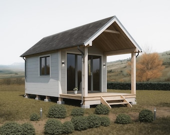 May include: A small, light gray cabin with a dark gray roof and a wooden porch. The cabin has large glass doors and windows, with a small flower pot on the porch. The cabin is surrounded by green grass and bushes.