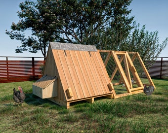 May include: A wooden chicken coop with a nesting box and a wire run. The coop is painted a natural wood color and has a metal roof. There are three chickens in the run, two of which are black and white and one is brown.