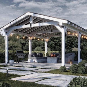 May include: A white wooden gazebo with a dark roof, string lights, and a concrete patio. The outdoor structure features a grill, seating, and a fire pit, surrounded by lush greenery and a cloudy sky.