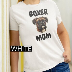 Unisex Softstyle T-Shirt. Boxer dog, Dog lover, Pet parent, Canine companion, Boxer breed, Dog mom, Animal affection, Paw print design