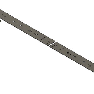 Puede incluir: Un sistema de rieles de metal con múltiples agujeros para montar accesorios. El riel está hecho de dos piezas que se conectan entre sí.