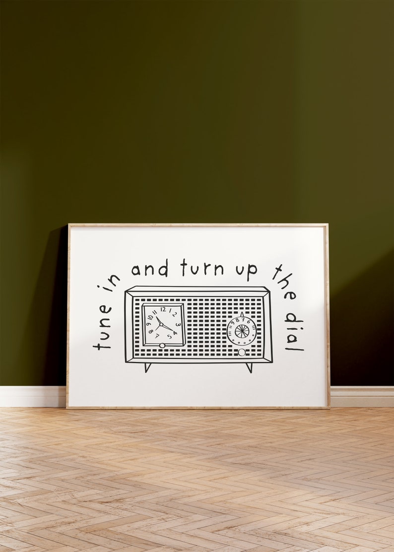 May include: A black and white illustration of a vintage radio with the text "tune in and turn up the dial".