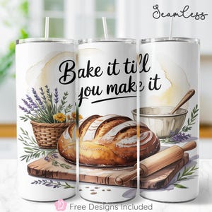 May include: White tumbler with a baking theme. The design includes a loaf of bread, a rolling pin, a mixing bowl, and a basket of lavender. The text "Bake it til' you make it" is written in black script. The tumbler has a straw.
