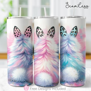 May include: Three stainless steel tumblers featuring a pink, blue, and purple fluffy bunny tail design. The tumblers have a white background with a watercolour effect. The text "Seamless" is at the top of the image.