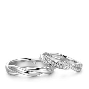 May include: Two silver rings with a braided design. One ring is a solid band, while the other features a row of small, sparkling stones. The rings are set against a white background.