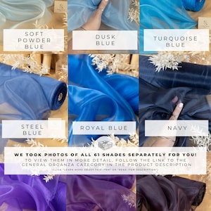 May include: A collection of 10 different colors of sheer organza fabric. The colors are soft powder blue, dusk blue, turquoise blue, steel blue, royal blue, navy, royal purple, deep purple, and blackberry.  The fabric is shown rolled up and draped over a hand.